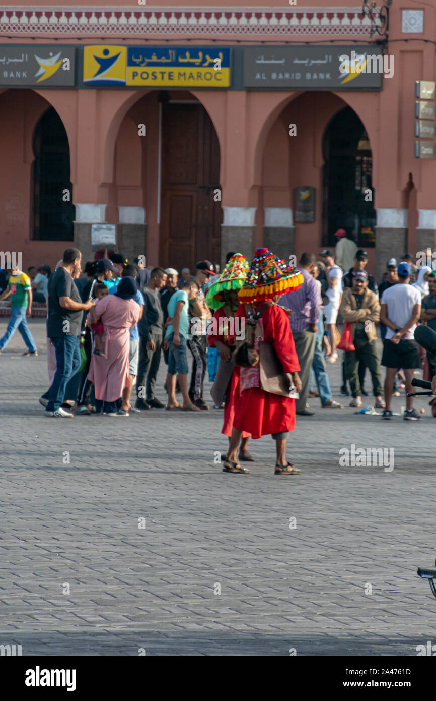 Aguador, man who gives water, in the square of Plaza de Yamaa el Fna in Marrakech in October 2019 Stock Photo