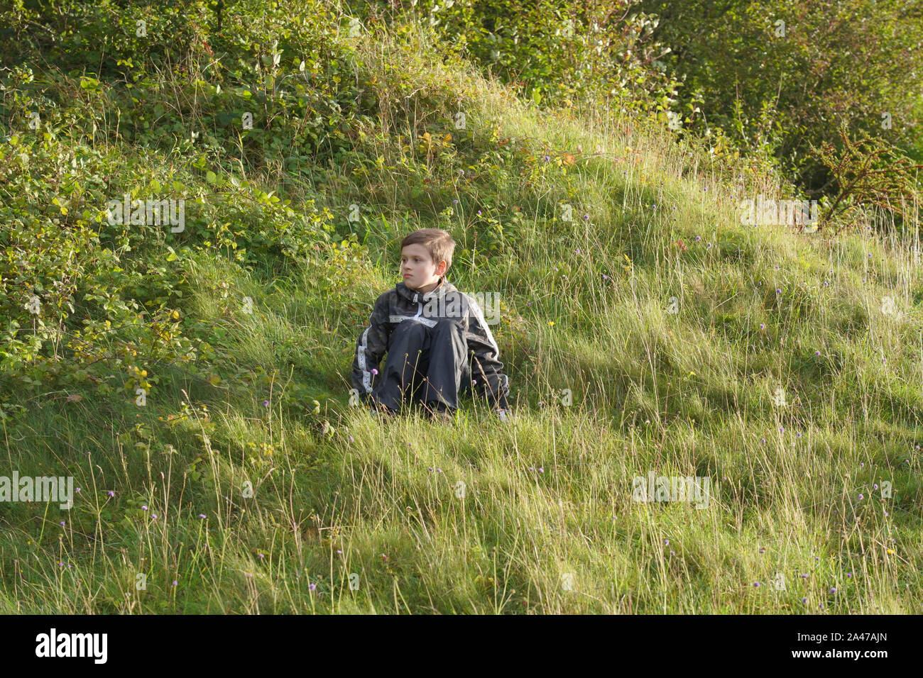 A boy outdoor, Malling Down nature reserve near Lewes, East Sussex, England Stock Photo