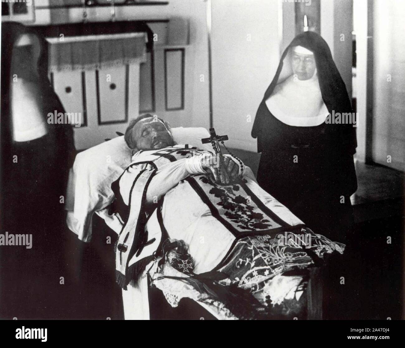 Father Damien on his funeral bier with Mother Marianne Cope by his side. Stock Photo