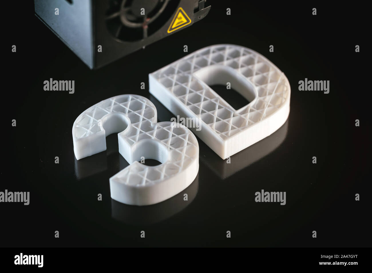 3D printing concept. 3D letters ABS white color against black background, Thermoplastic material from polylactic (pla) acid. Stock Photo