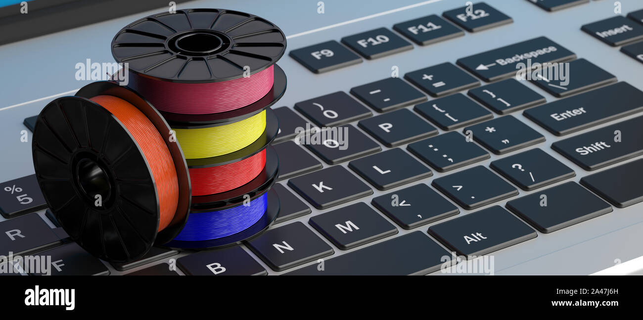 3D printer computer software. Reels of colorful plastic filaments for 3D printing on a laptop keyboard, banner. 3d illustration Stock Photo