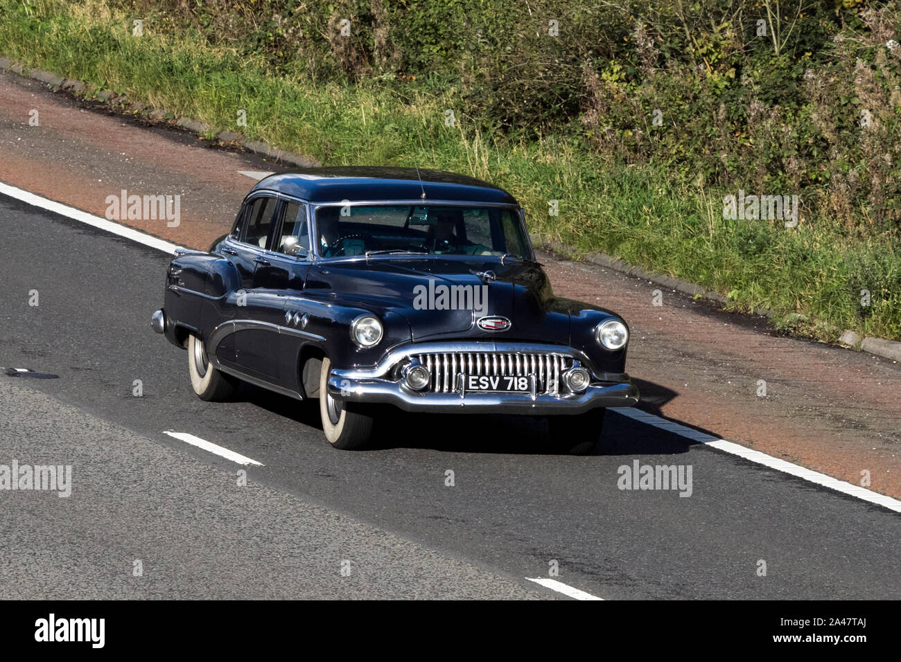 1952 black American Buick, vehicle travelling northbound on the M6 motorway near Garstang in Lancashire, UK. Stock Photo