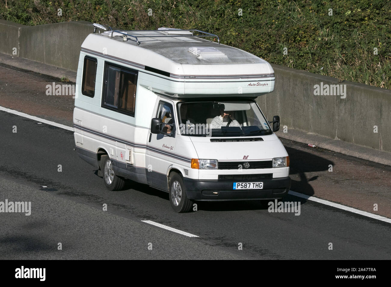 Volkswagen auto sleeper 1200 Swb traveling on the M61 motorway near Manchester, UK Stock Photo