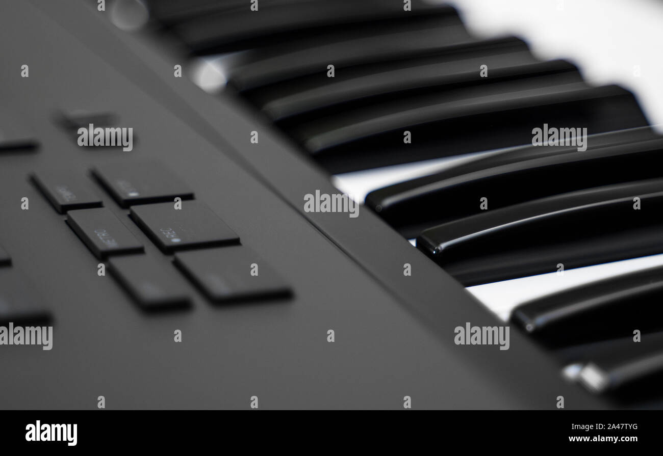 Professional midi keyboard synthesizer with knobs and controllers. Stock Photo