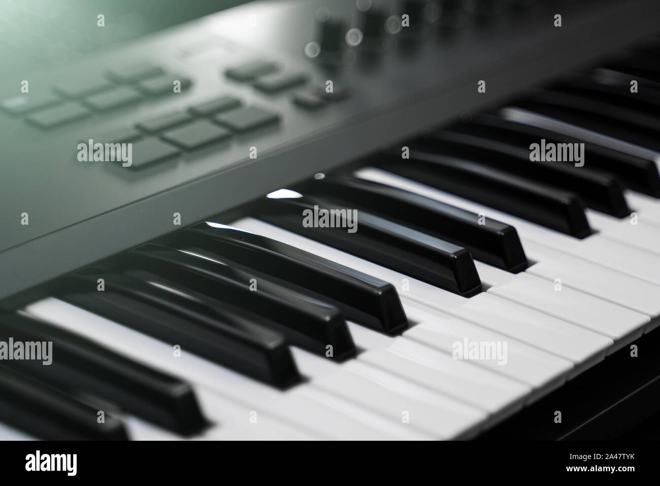 Professional midi keyboard synthesizer with knobs and controllers. Stock Photo