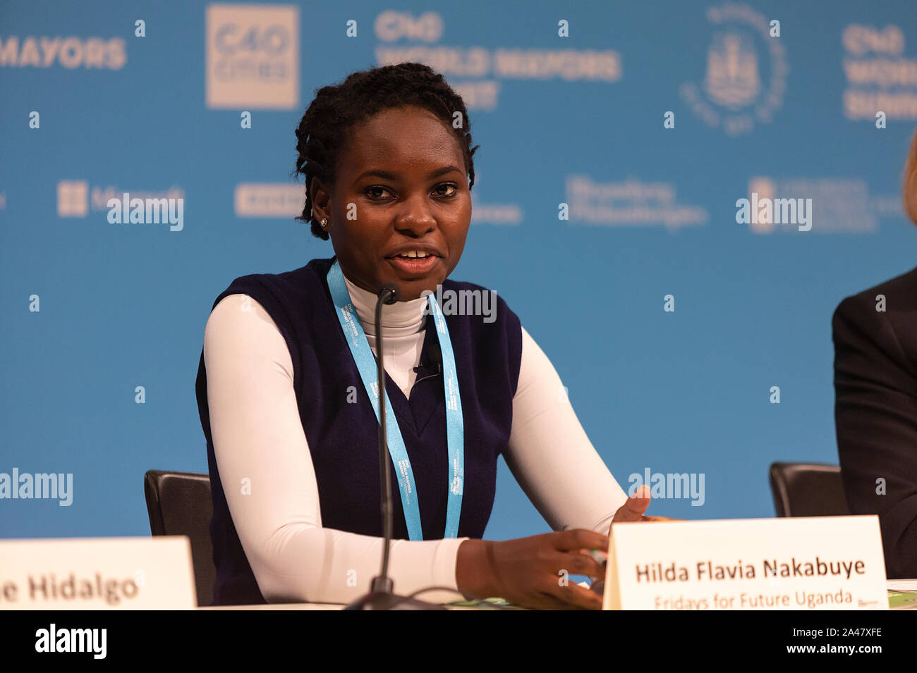 COPENHAGEN, DENMARK – OCTOBER 11, 2019: Hilda Flavia Nakabuye,  climate activists within the ‘Fridays for Future’ movement,  Uganda, during the ‘Mayors and Youth Activist’ press conference at the C40 World Mayors Summit. The young activist from Uganda gave a powerful and emotional speech. During the press conference young activist explained what they expect of the grown-up politicians. More than 90 mayors of some of the world’s largest and most influential cities representing some 700 million people meet in Copenhagen from October 9-12 for the C40 World Mayors Summit. The purpose with the summ Stock Photo