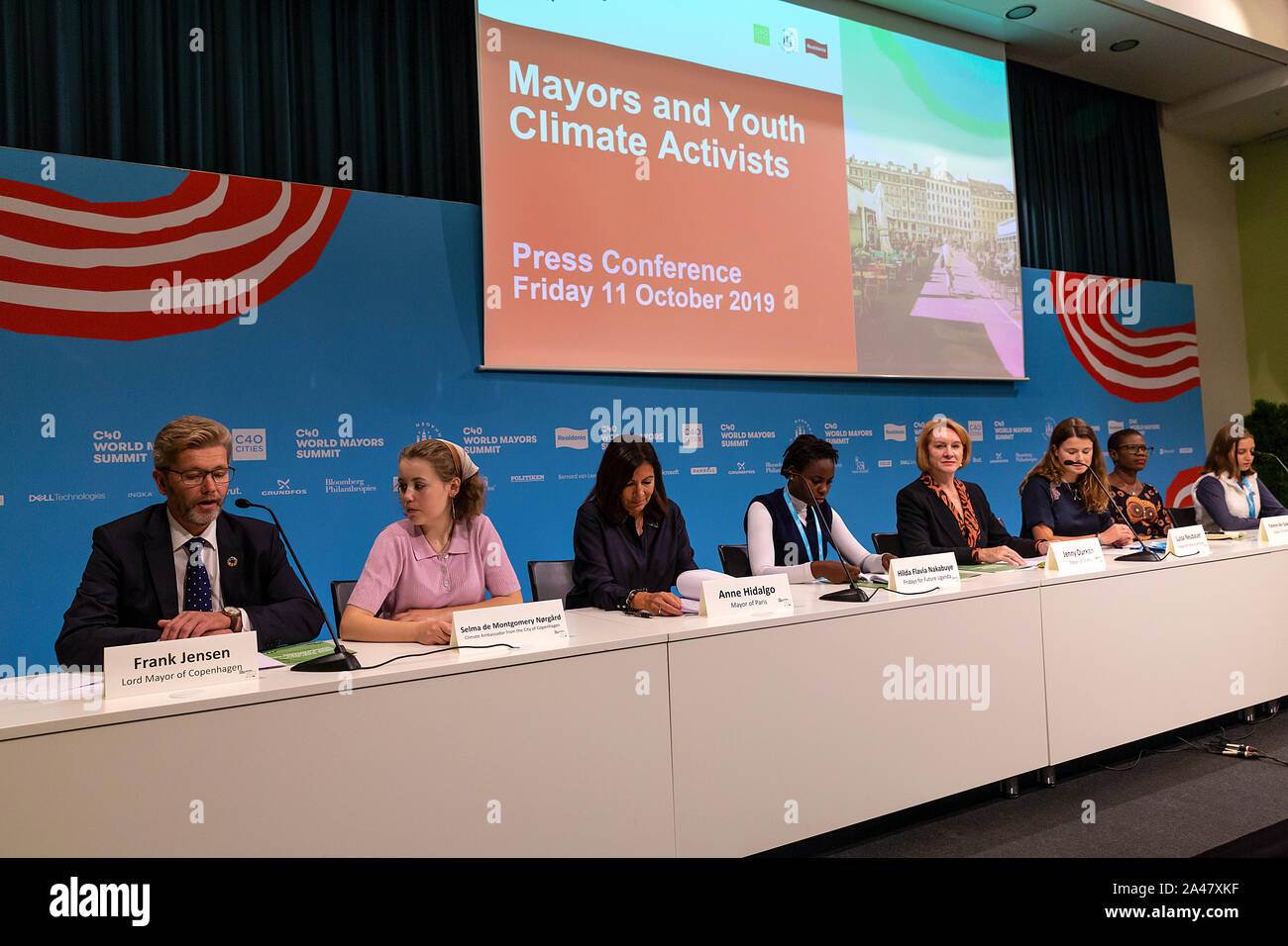 COPENHAGEN, DENMARK – OCTOBER 11, 2019: Mayors and  youth activist holds a joint press conference at the C40 World Mayors.  During the press conference young activist explained what they expect of the grown-up politicians. More than 90 mayors of some of the world’s largest and most influential cities representing some 700 million people meet in Copenhagen from October 9-12 for the C40 World Mayors Summit. The purpose with the summit in Copenhagen is to build a global coalition of leading cities, businesses and citizens that rallies around radical and ambitious climate action. Stock Photo