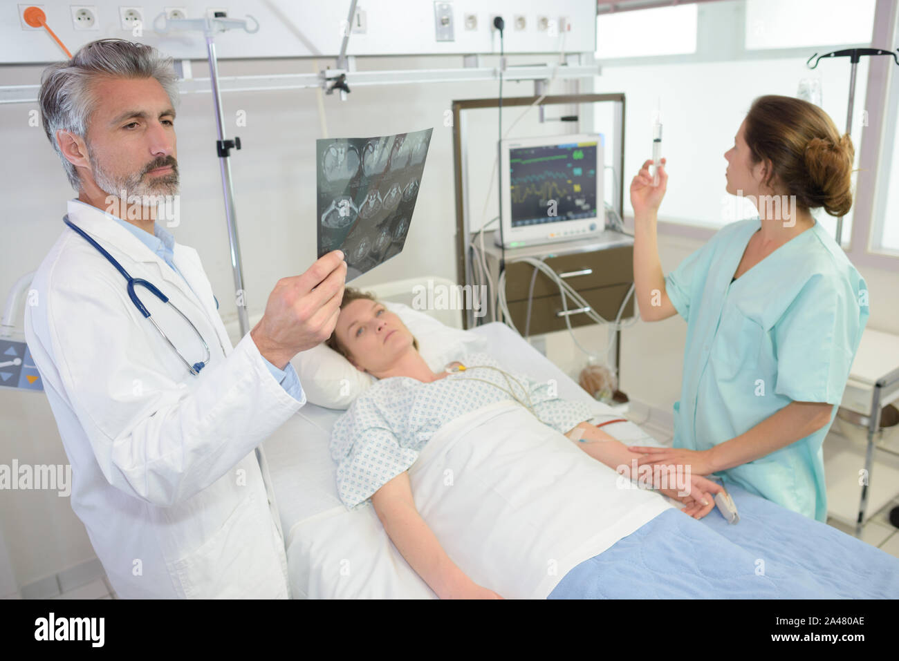radiologist checks xray in hospital room Stock Photo Alamy