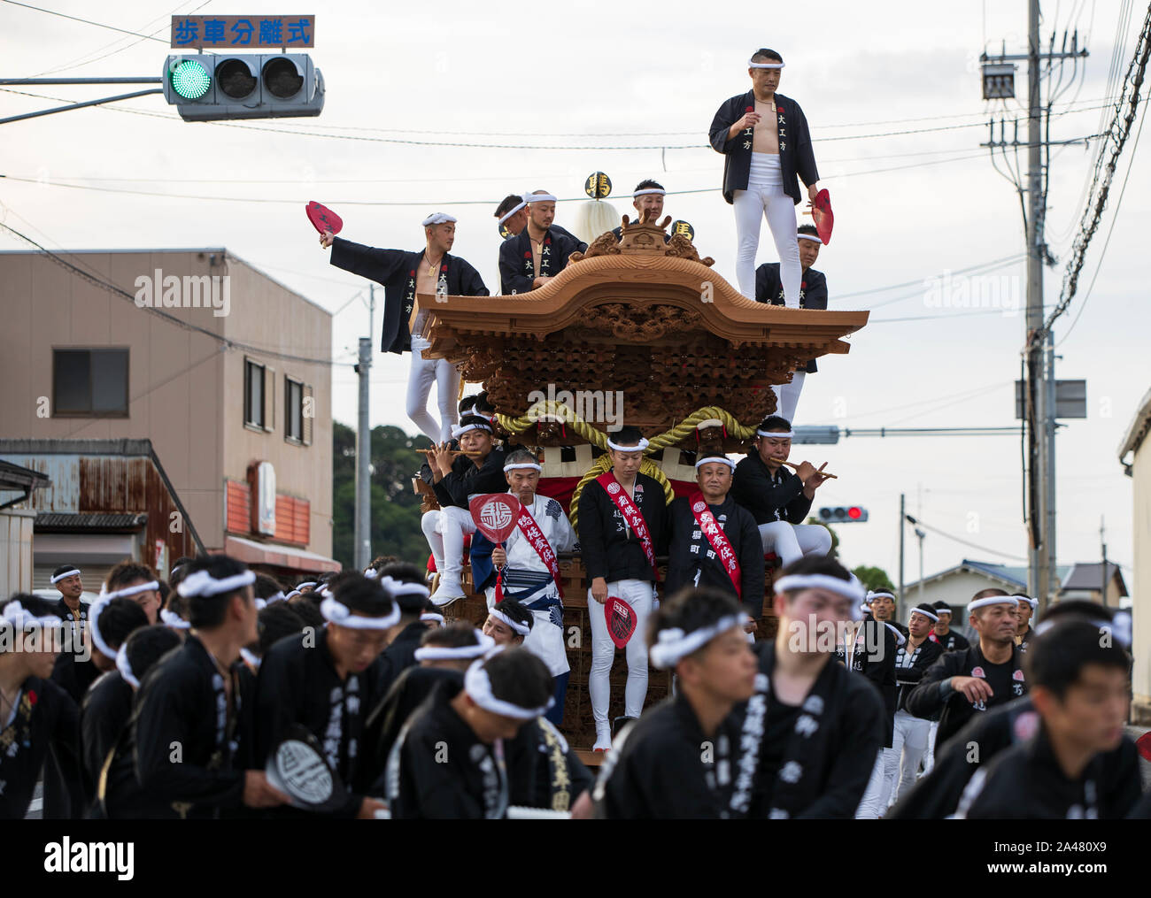 Kumatori, Japan - October 6, 2019: Local leaders atop cart amid crowd at local danjiri festival Stock Photo
