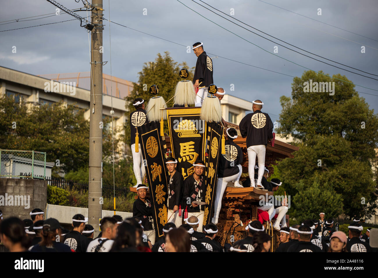 Kumatori, Japan - October 6, 2019: Local leaders atop cart amid crowd at local danjiri festival Stock Photo