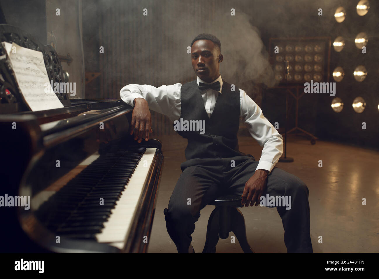 Ebony grand piano player, jazz performer Stock Photo - Alamy