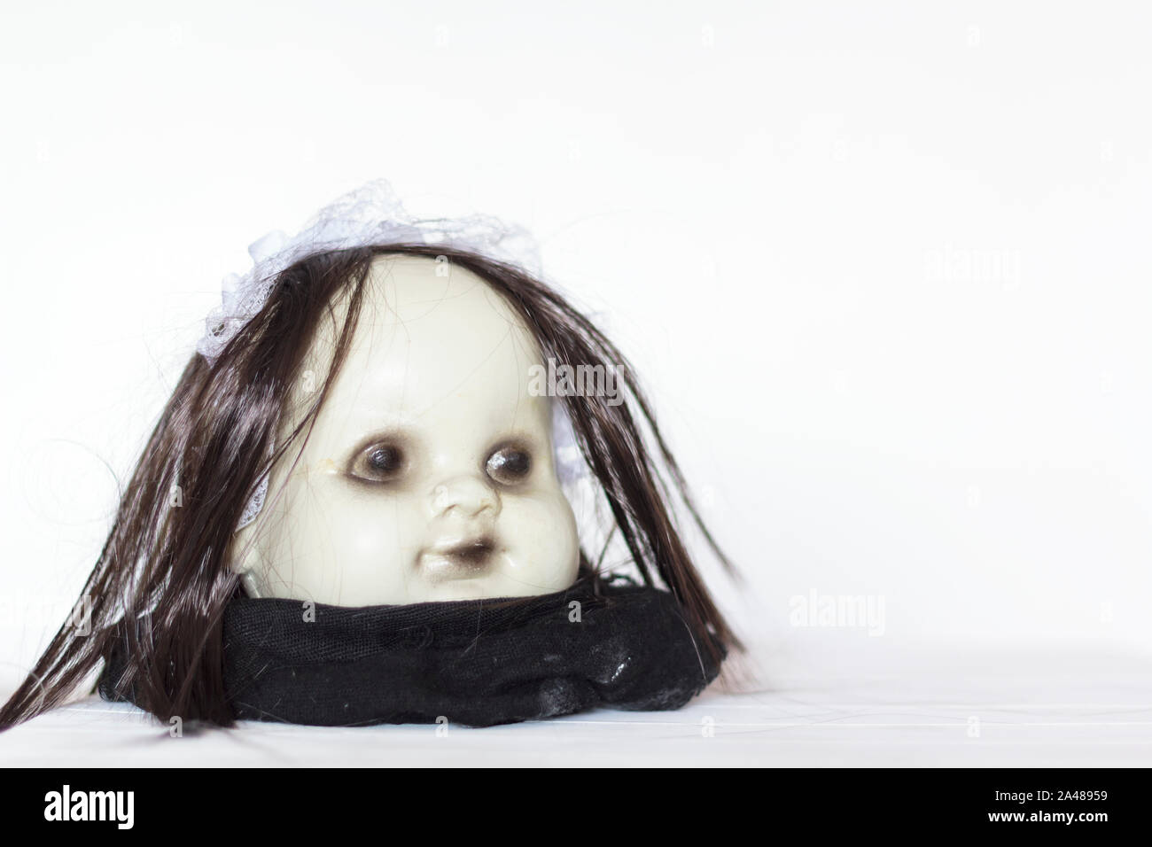 Scary Doll Head with copy space. Halloween theme Stock Photo - Alamy