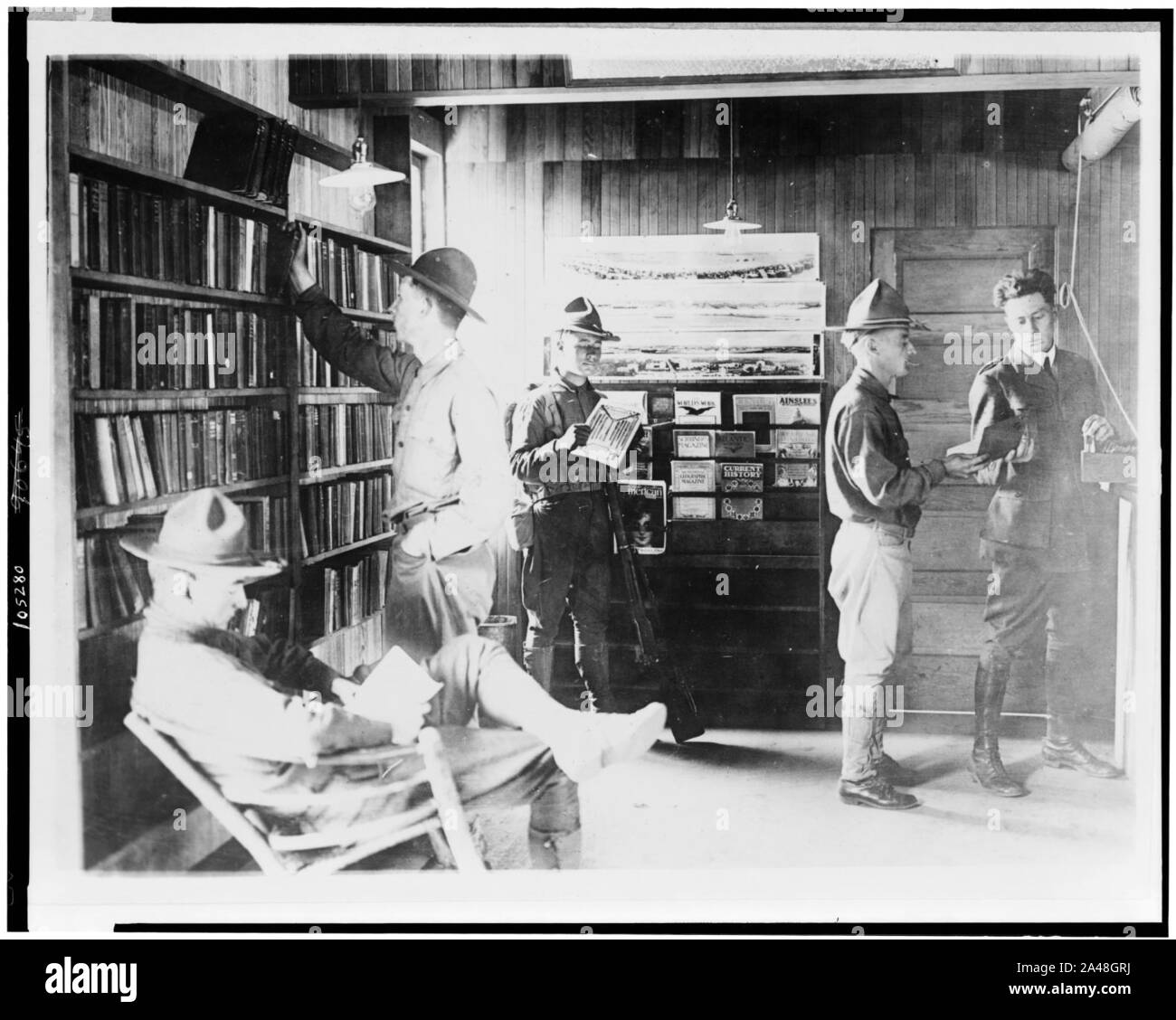 Five U.S. soldiers in Y.M.C.A. library Stock Photo
