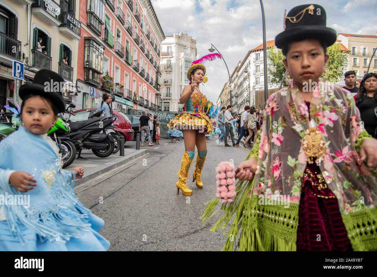 Madrid, Spain. 12th Oct, 2019. Several hundred people have seconded this Saturday in Madrid the demonstration called 'Decolonicémonos. October 12. Nothing to celebrate' to claim 'the resistance of indigenous peoples for more than 500 years.' The march, convened by more than a dozen groups in defense of these towns, has left Puerta del Sol and has traveled some streets of Madrid in a festive atmosphere, with the participation of numerous traditional folklore groups in Bolivia, Peru, Paraguay or Brazil, among others, dressed in their typical costumes. Credit: Pacific Press Agency/Alamy Live News Stock Photo