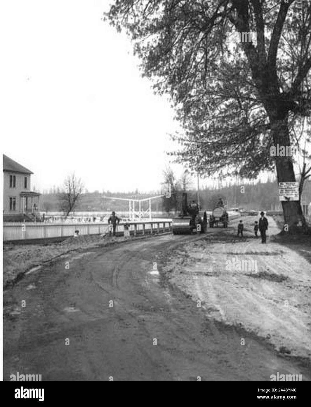 First hardsurface road in Washington state under construction along the bank of the Duwamish