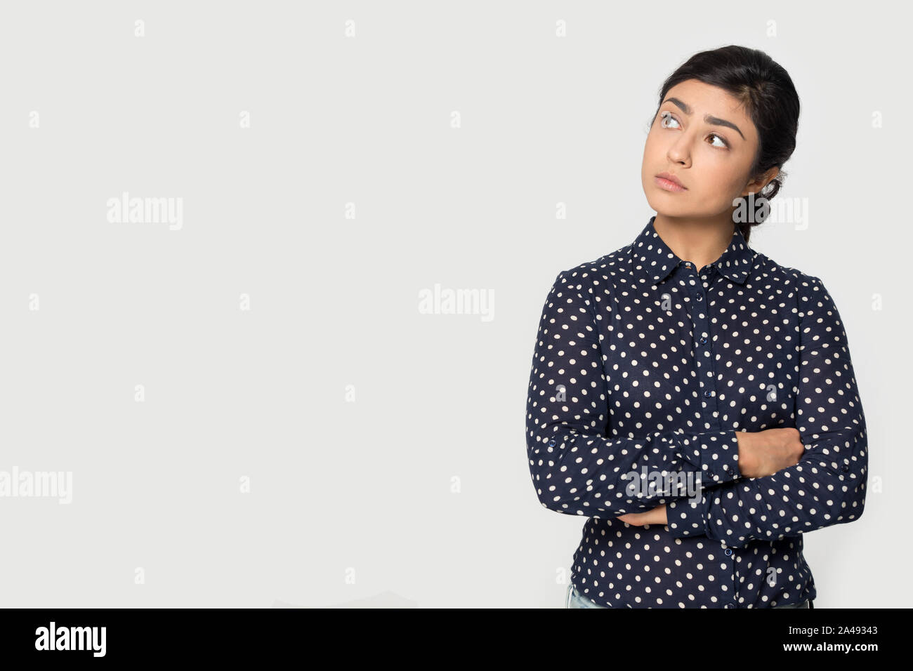 Pensive indian woman think look at blank copy space Stock Photo - Alamy