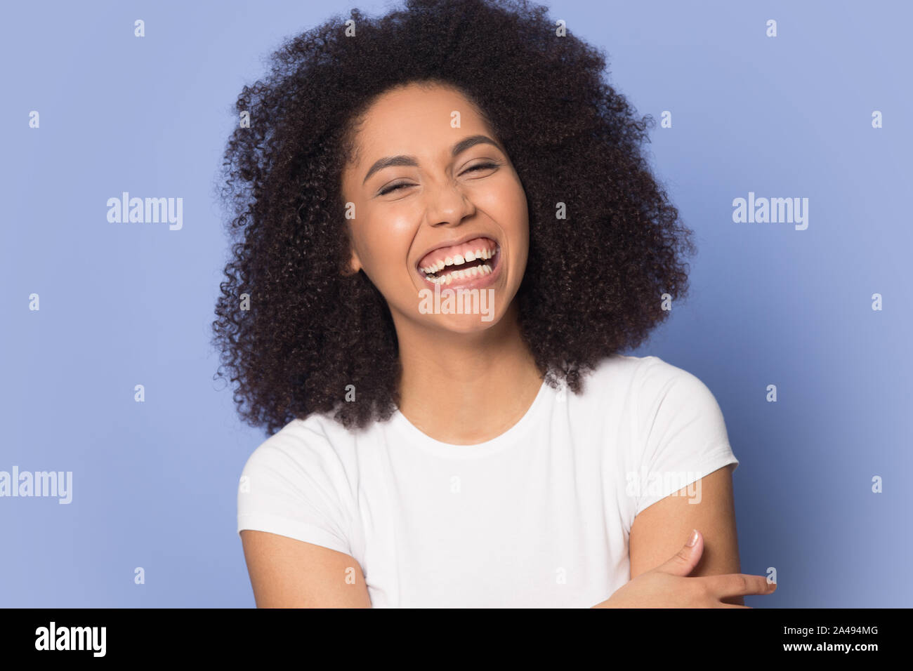 Overjoyed african American girl laugh at funny joke Stock Photo
