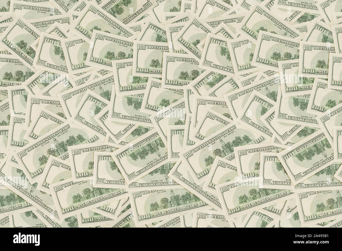 flat seamless texture and background of real one hundred united states of america dollar banknotes, back reverse side in random pattern Stock Photo