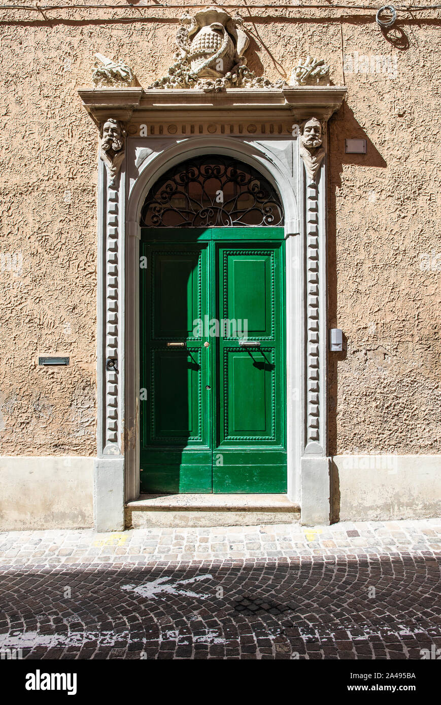 Typical italian facade with door. Italian house. Traditional style and