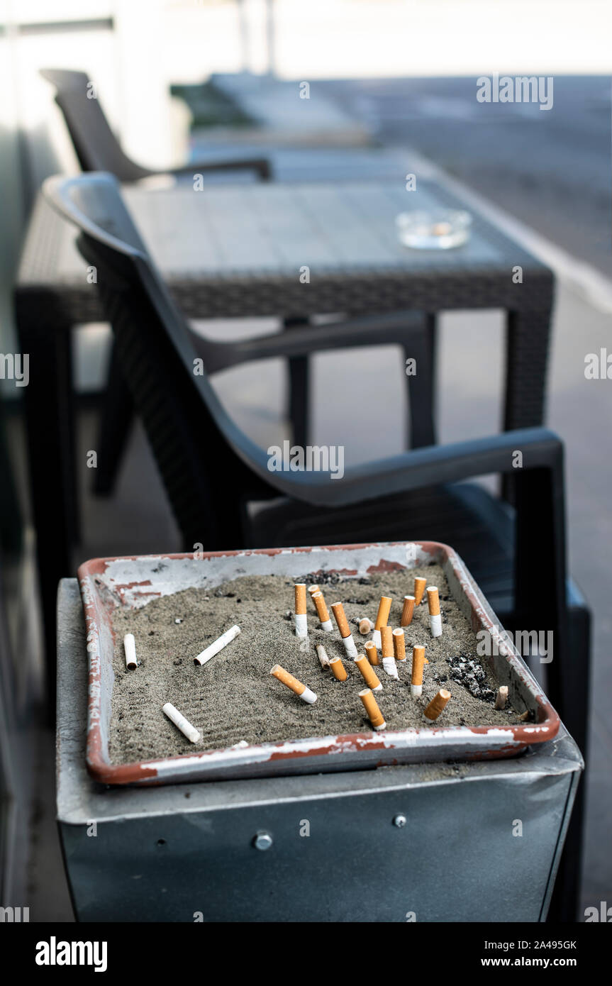 Cigarette butts sand hi-res stock photography and images