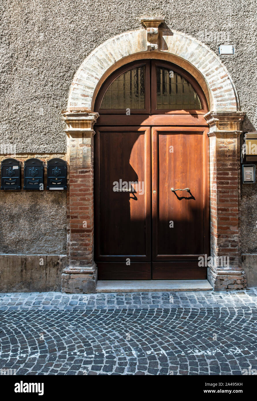 Typical italian facade with door. Italian house. Traditional style and