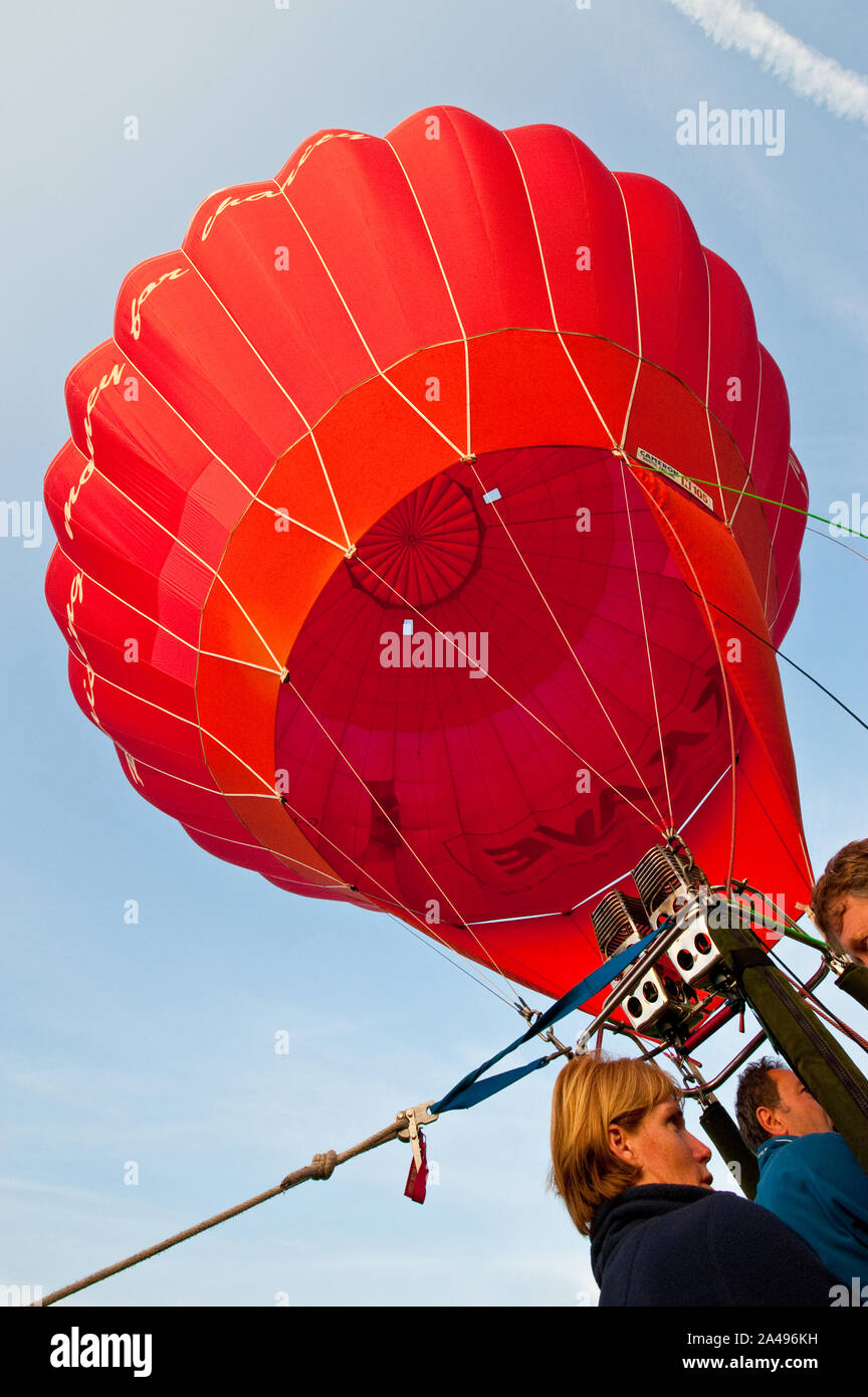 Inflating red hot air balloon hi-res stock photography and images - Alamy
