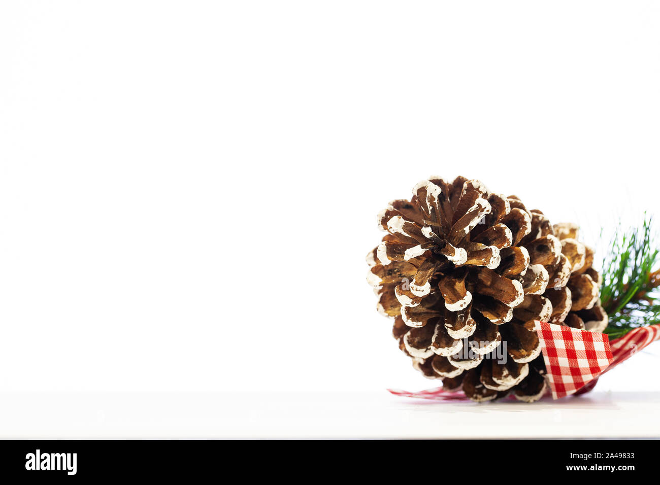 Christmas pine cone with place for text on white background Stock Photo