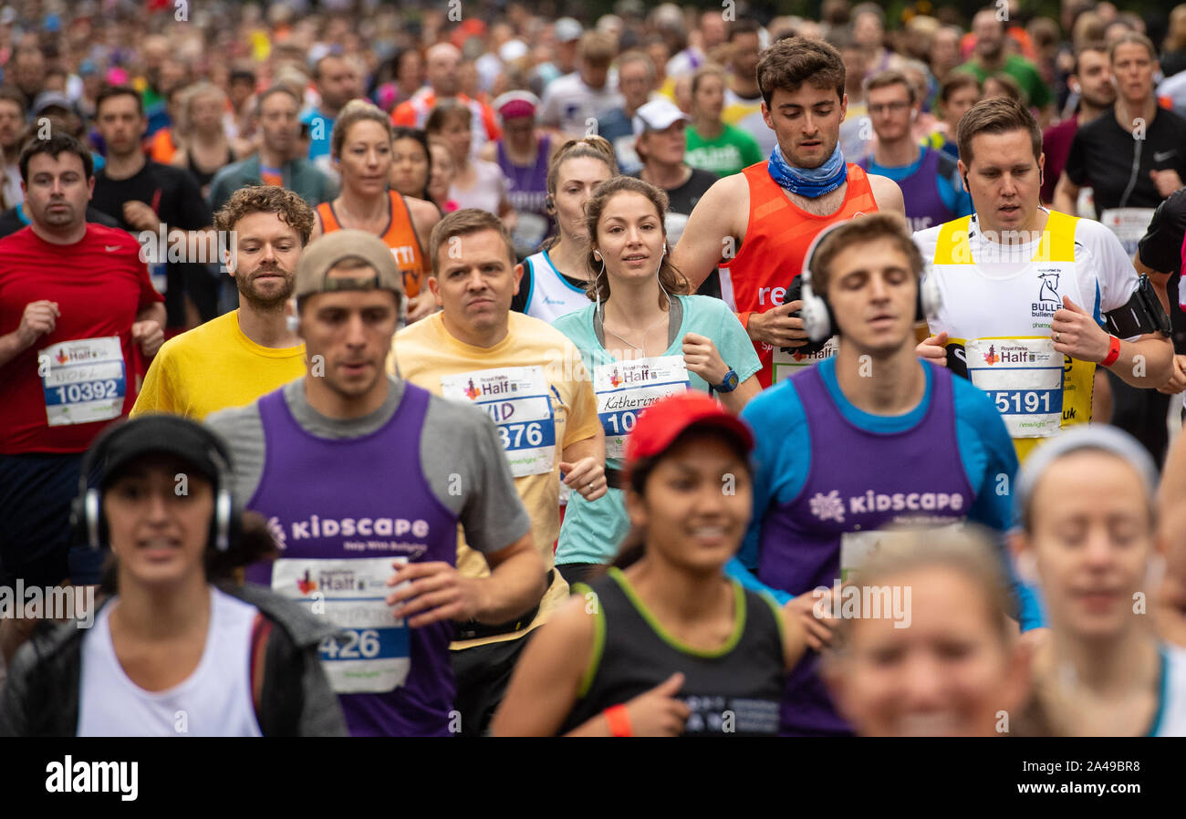 Runners set off at the start of the Royal Parks Foundation Half Marathon, in Hyde Park, London, which sees over 16,000 runners take on a 13.1 mile course through four of London's eight Royal Parks. Stock Photo