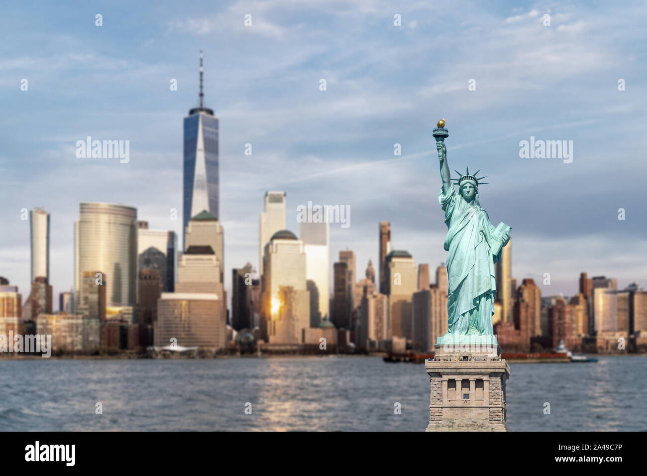 Statue of Liberty with background of New York city Manhattan skyline  cityscape at sunset from New Jersey Stock Photo - Alamy