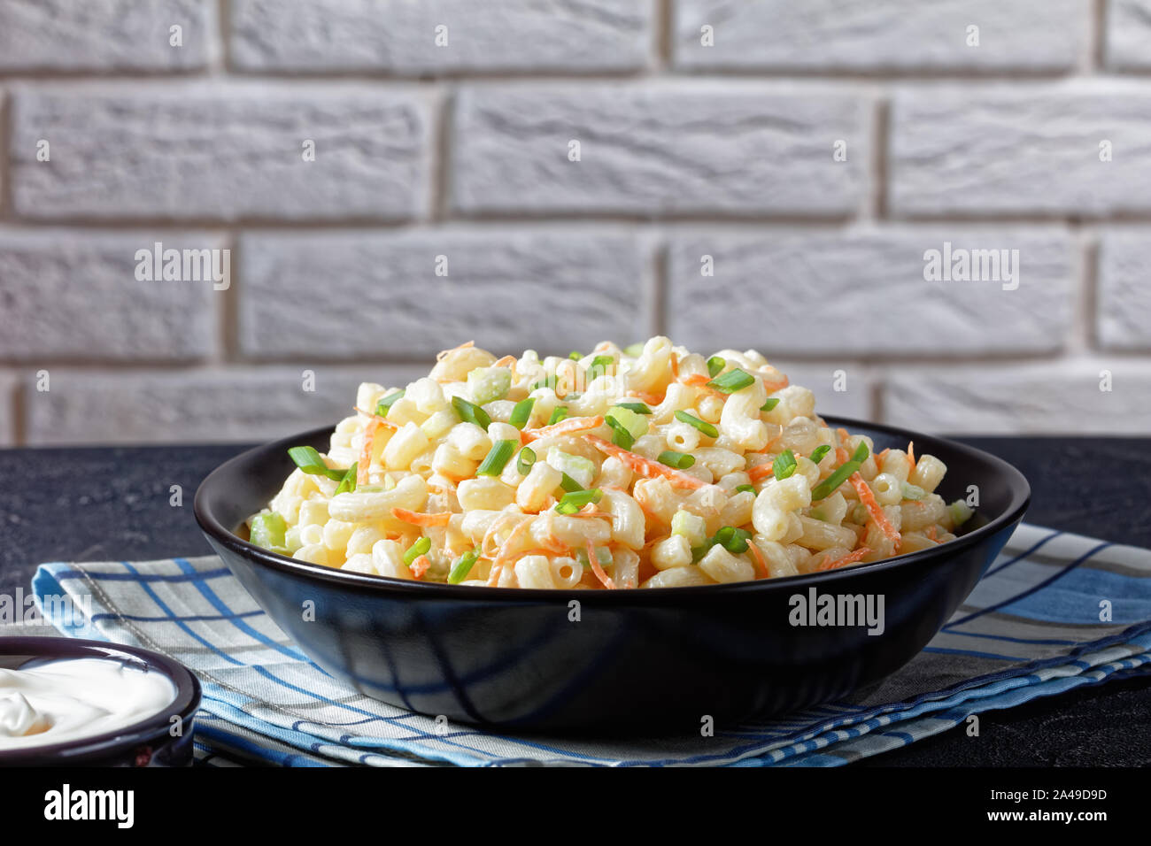 delicious creamy macaroni salad of elbow pasta with grated carrots