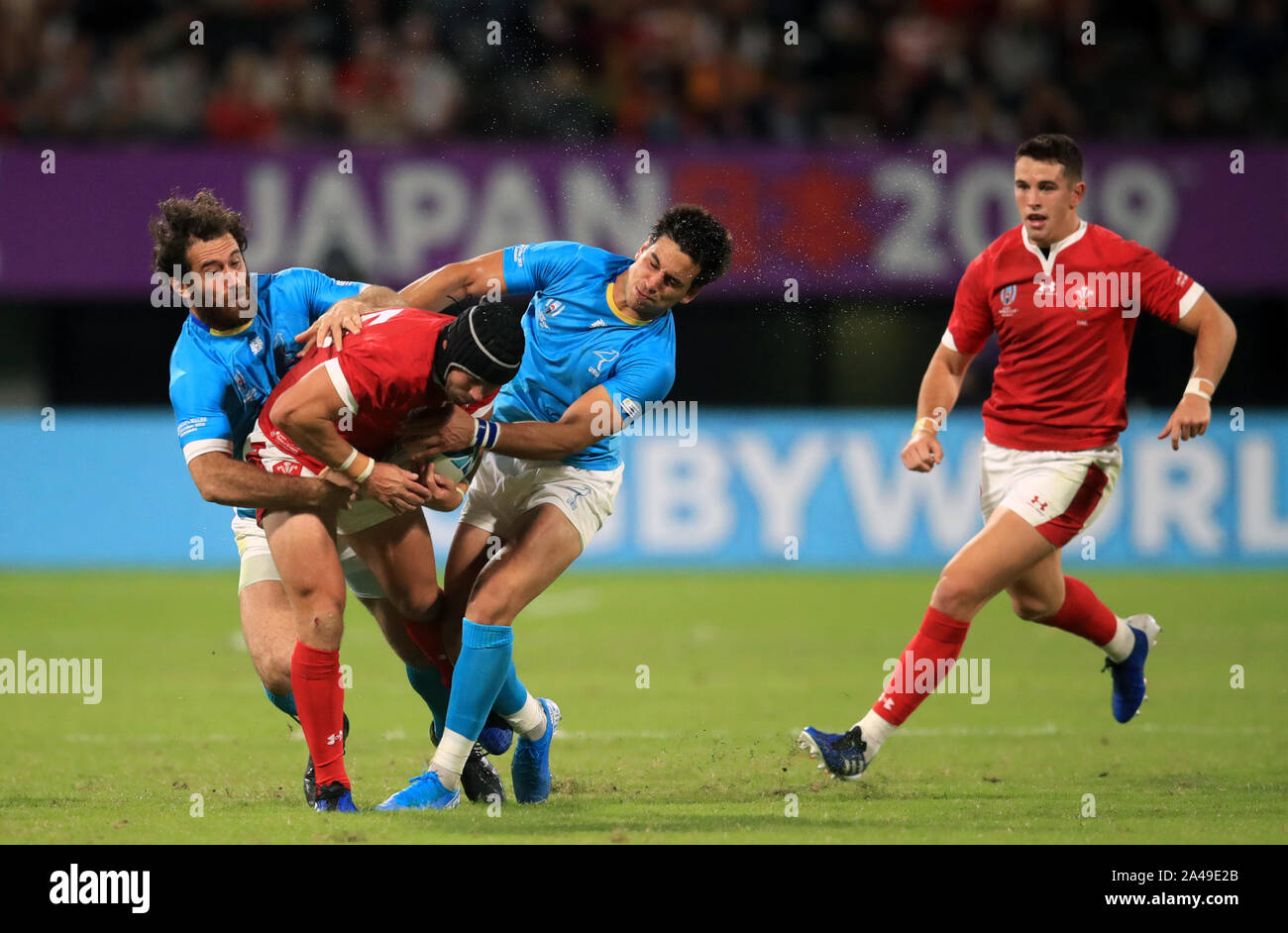 Wales' Leigh Halfpenny is tackled during the 2019 Rugby World Cup match ...