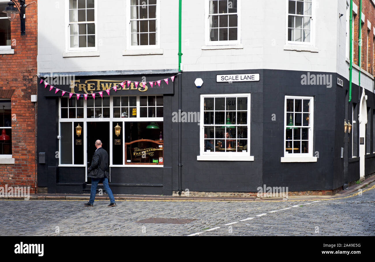 Man walking past Fretwell's bar, Scale Lane, Kingston upon Hull, East
