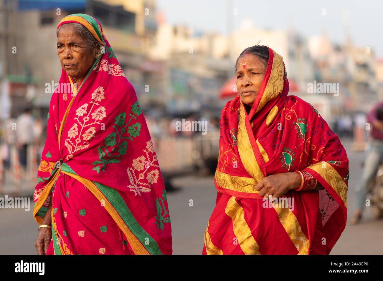 PURI, INDIA, JANUARY 13, 2019 : Two Indian women in traditional saree are walking in the street of the large market near the Shree Jagannath Temple Stock Photo