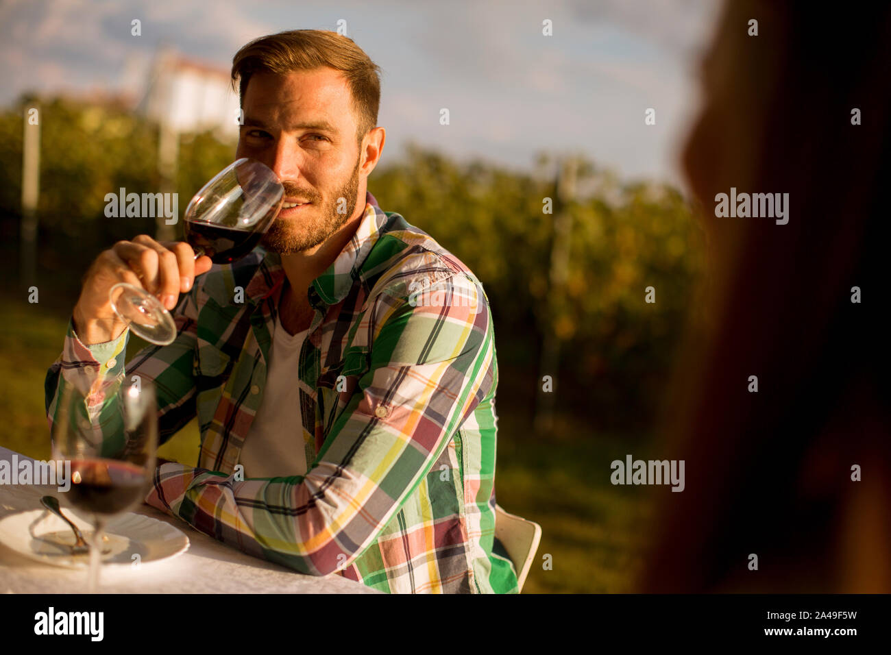 Young man sitting picnic table hi-res stock photography and images - Alamy