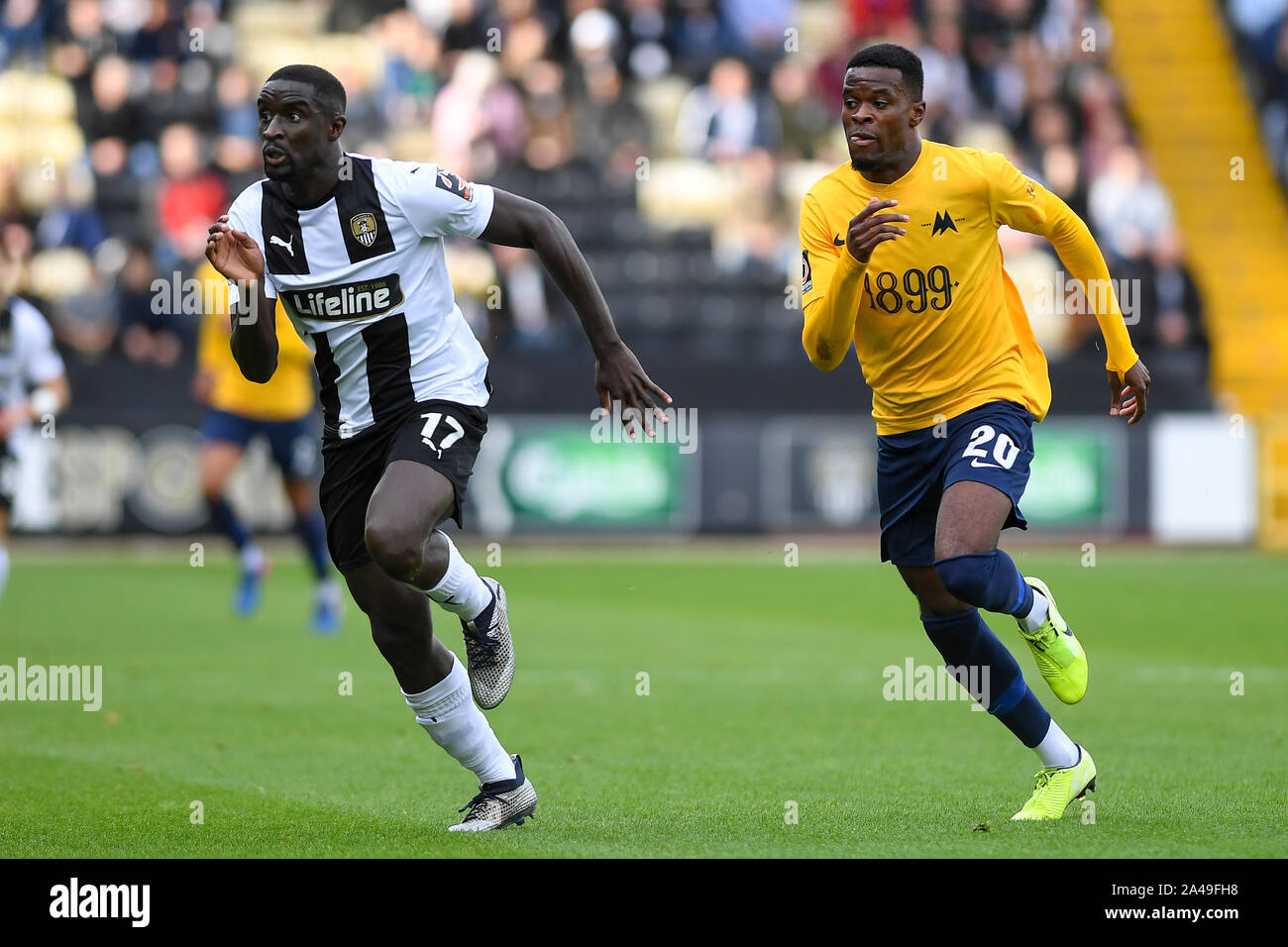 Nottingham, UK. 12 October 2019. Zoumana Bakayogo of Notts County and Kalvin Lumbombo-Kalala of Torquay United during the Vanarama National League match between Notts County and Torquay United at Meadow Lane, Nottingham on Saturday 12th October 2019. (Credit: Jon Hobley | MI News) Editorial Use Only Credit: MI News & Sport /Alamy Live News Stock Photo