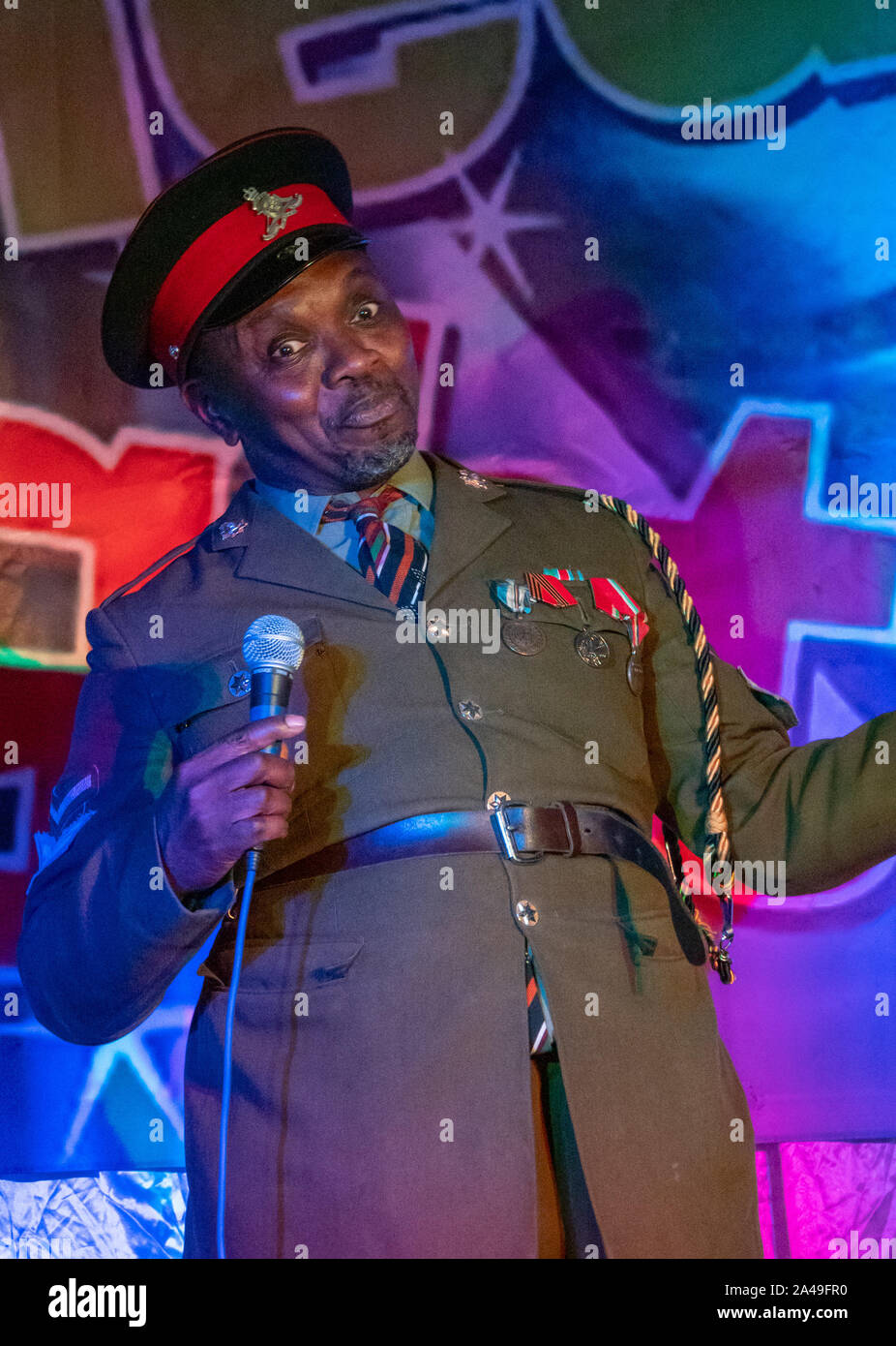Henlow, Bedfordshire, UK. 9th October 2019. African dictator, President Obonjo of the Lafta Republic, was in Henlow as part of his #justiceforobonjo campaign after E4 aired a show which he claims is a rip off of his act and character which he has been performing for many years on the comedy circuit. Comedian Benjamin Bello plays the character of exiled President Obonjo and is just back from a successful stint at the Edinburgh Fringe festival. Stock Photo