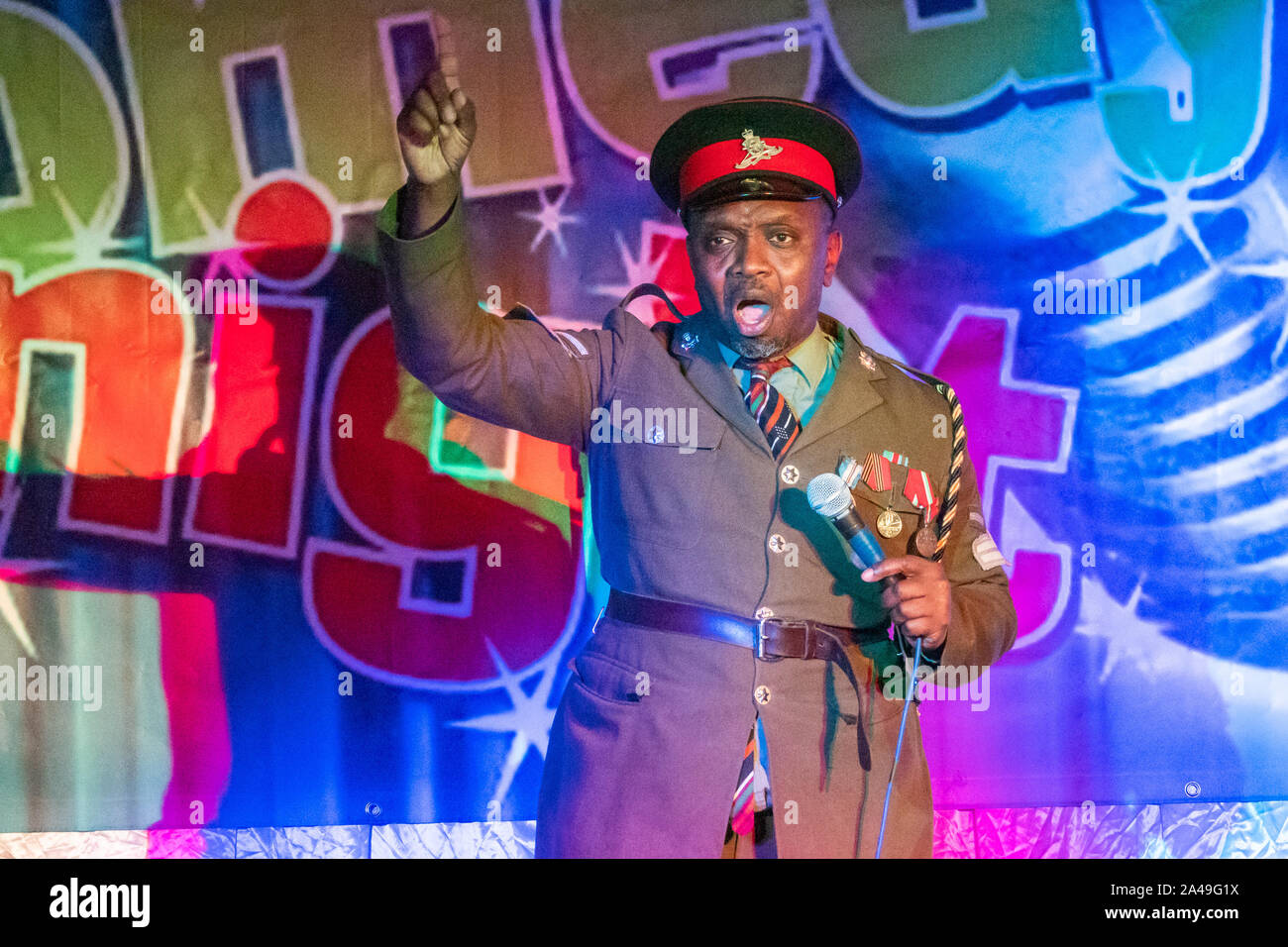 Henlow, Bedfordshire, UK. 9th October 2019. African dictator, President Obonjo of the Lafta Republic, was in Henlow as part of his #justiceforobonjo campaign after E4 aired a show which he claims is a rip off of his act and character which he has been performing for many years on the comedy circuit. Comedian Benjamin Bello plays the character of exiled President Obonjo and is just back from a successful stint at the Edinburgh Fringe festival. Stock Photo
