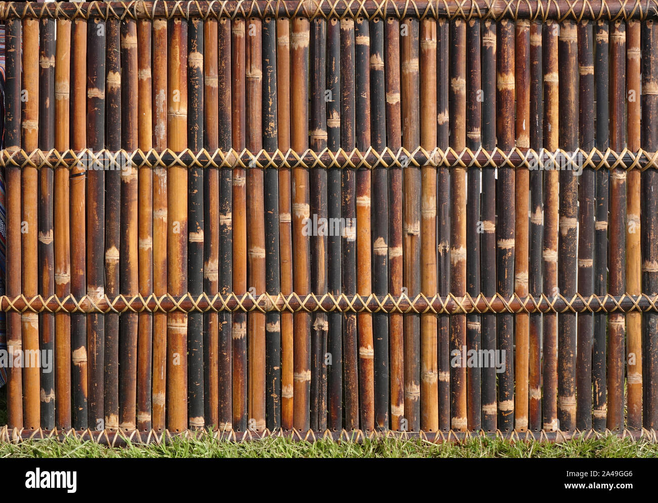 A traditional bamboo fence made from slats and strips Stock Photo Alamy