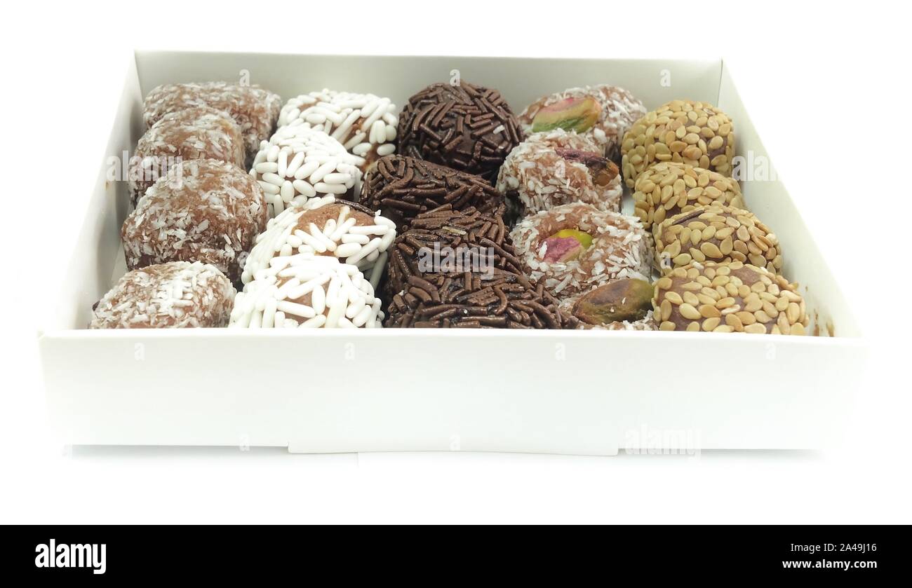 Sweet Food, Assorted Round Chocolate Candy Balls or Chocolate Bonbons in Paper Box Isolated on White Background. Stock Photo