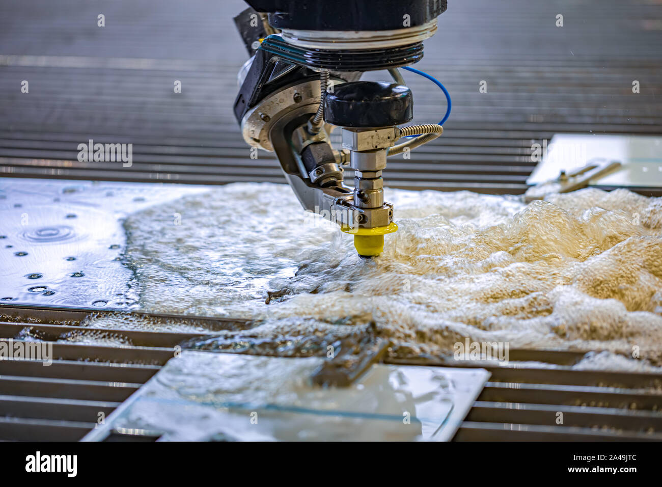 CNC water jet cutting machine modern industrial technology. Stock Photo