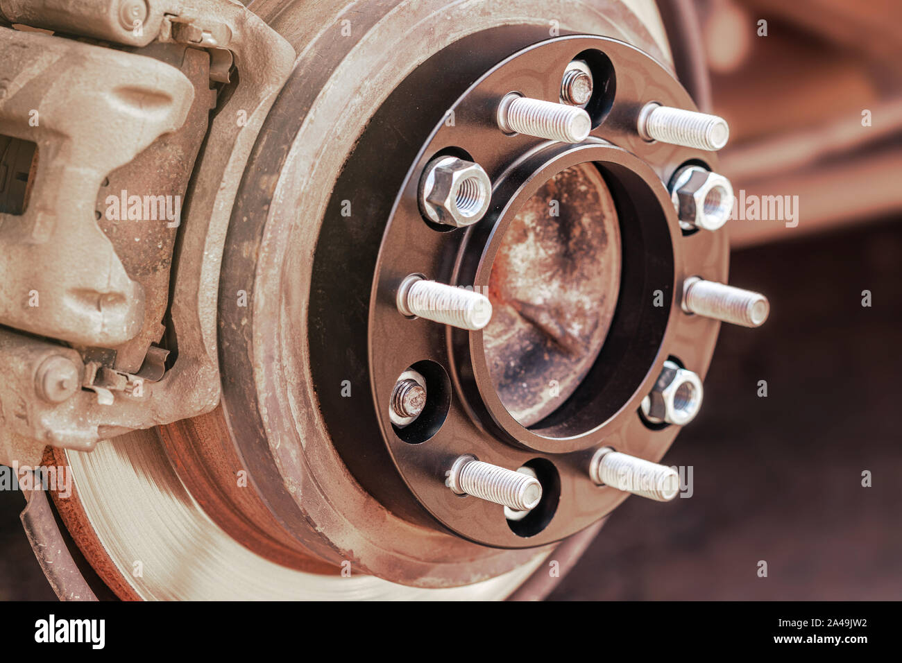 wheel spacer with studs for the car mounted on the wheel hub auto