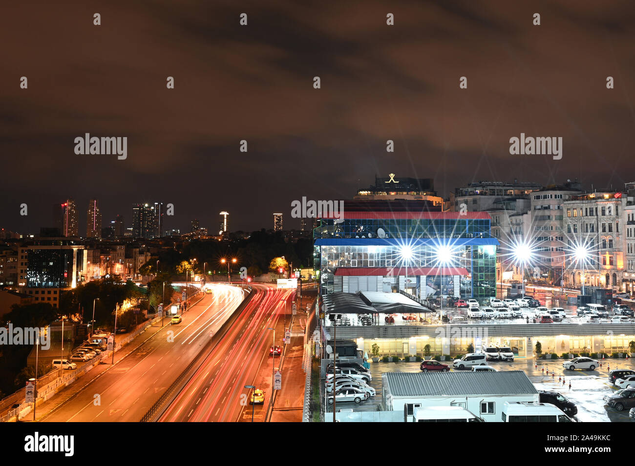 Istanbul, Turkey - October 7, 2019: A long-exposure nighttime view of Istanbul, with a parking lot and highway. Stock Photo