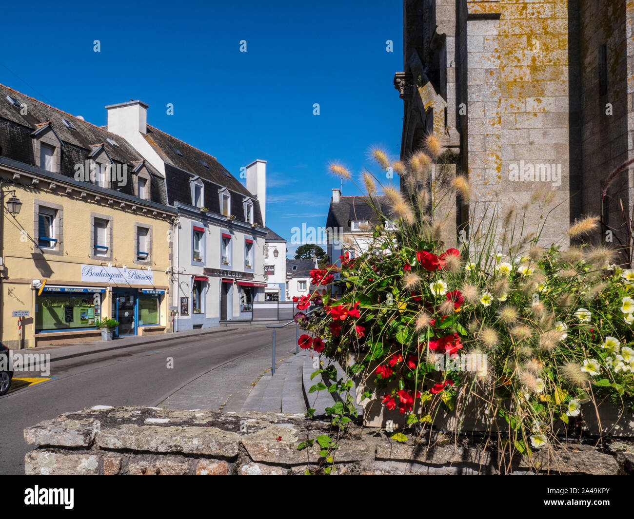 Moelan sur Mer small market Bretagne village town featuring the local Boulangerie/Patisserie and restaurant in the church square Brittany France Stock Photo