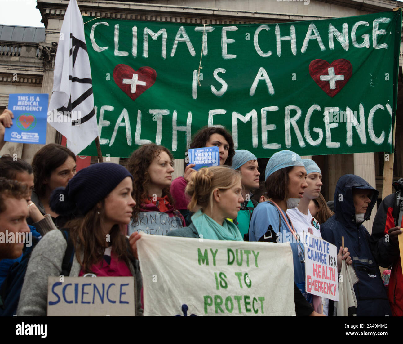 London, UK. 12th October, 2019. Doctors, nurses and health workers seen on Trafalgar Square, during the Extinction Rebellion two week long protest in London. Credit: Joe Kuis / Alamy News Stock Photo