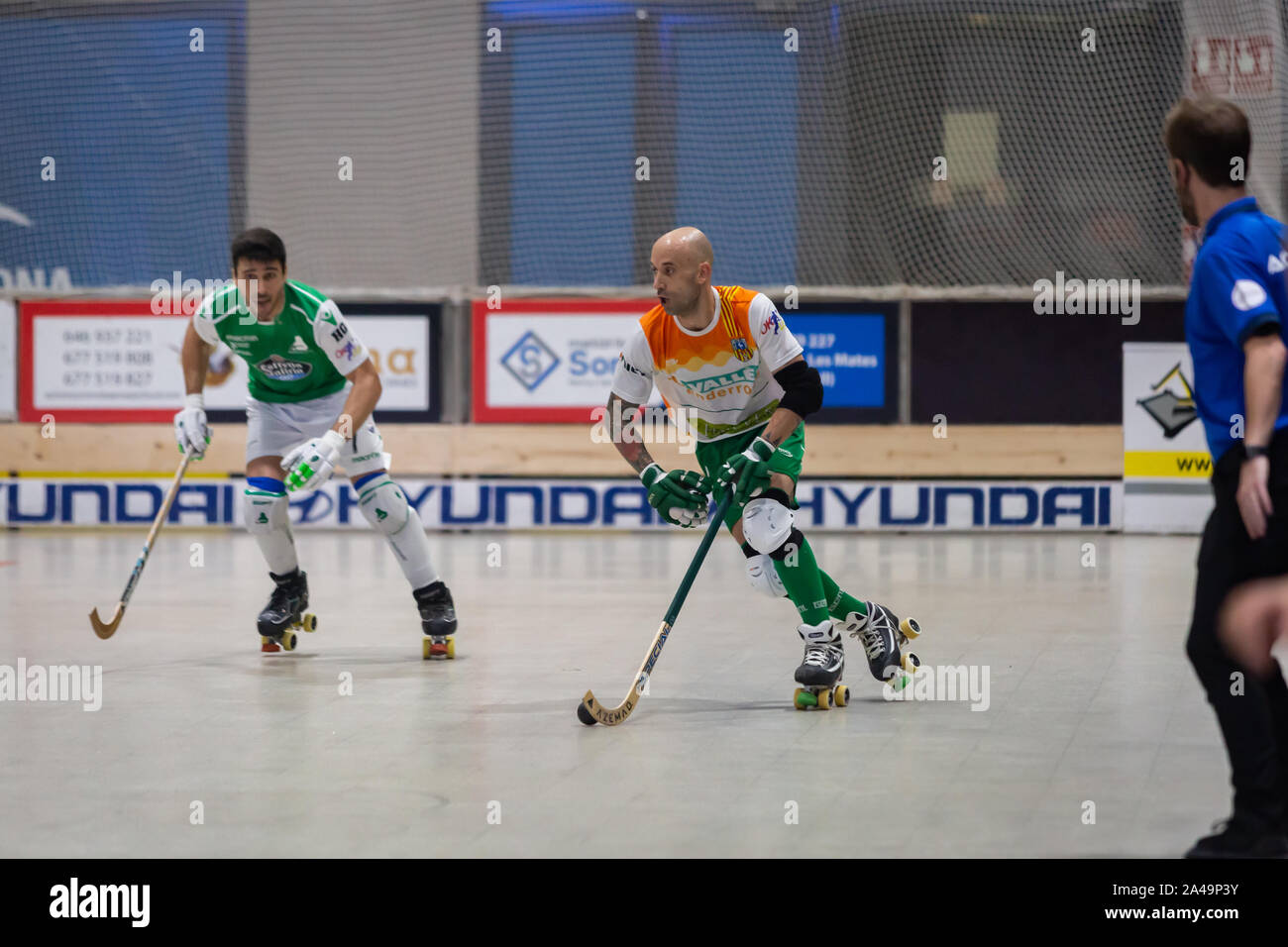 Angel Rodriguez Rojas roller hockey player of CP Calafell and Maximiliano Oruste Salva roller hockey player of Deportivo Liceo in action at Spanish OK Stock Photo