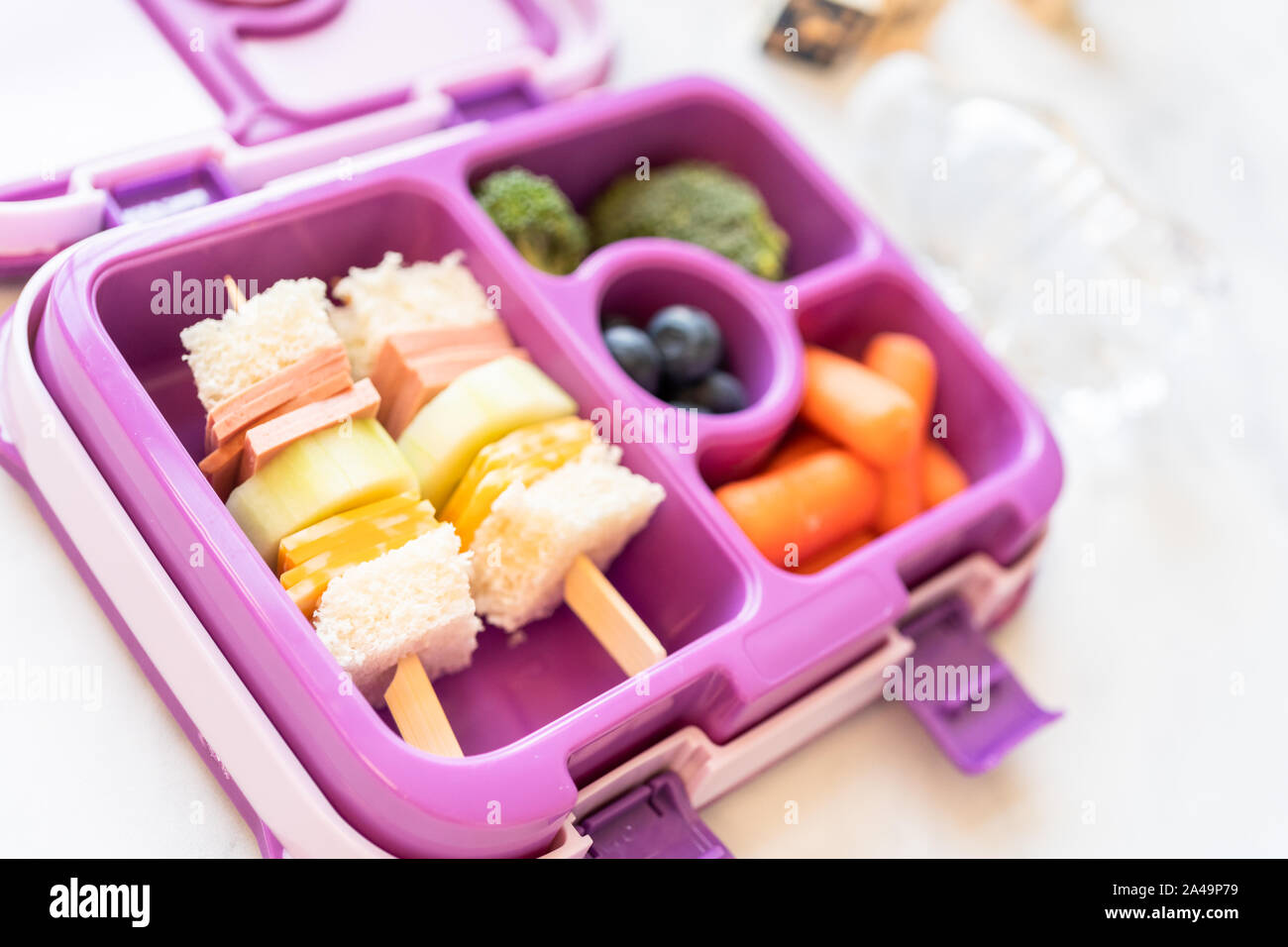 Healthy school lunch with kebab sandwich and vegetables in bento box ...