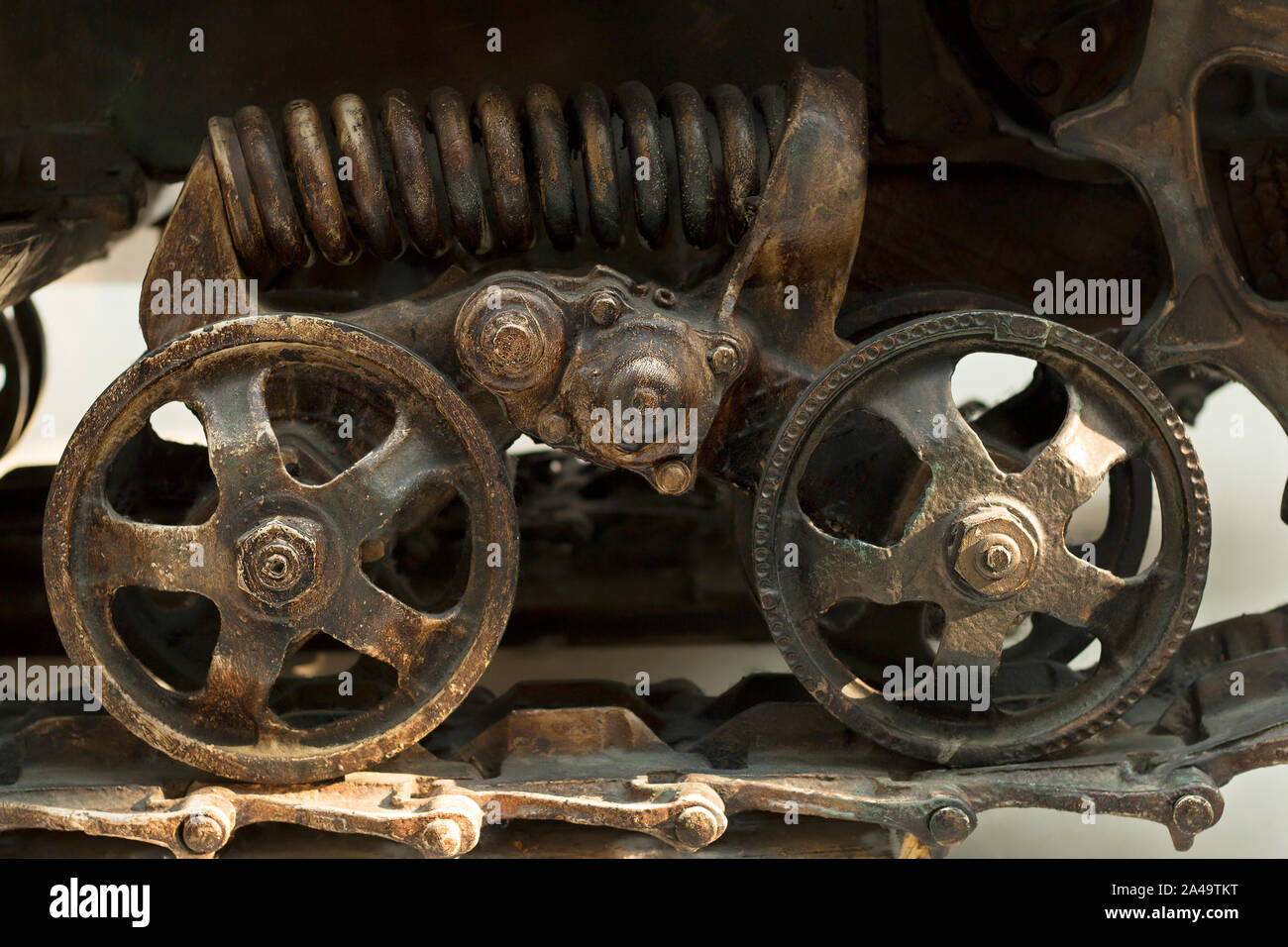 Details of the wheels and tracks of the tractor tracks. Close-up tractor protector with wheel. Vintage industrial background Stock Photo