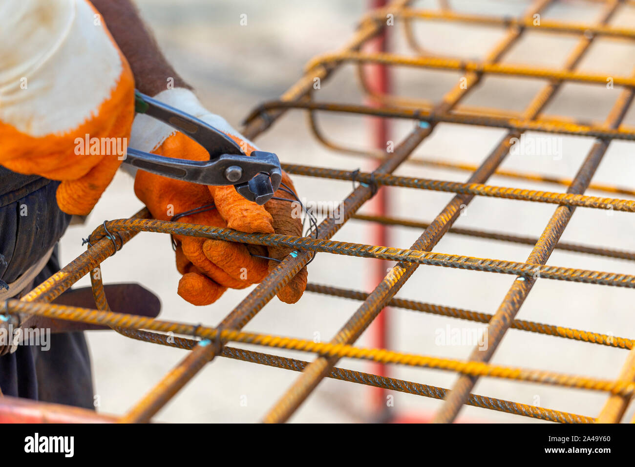 Tying reinforcing steel bars (rebar) for the construction. Tightening