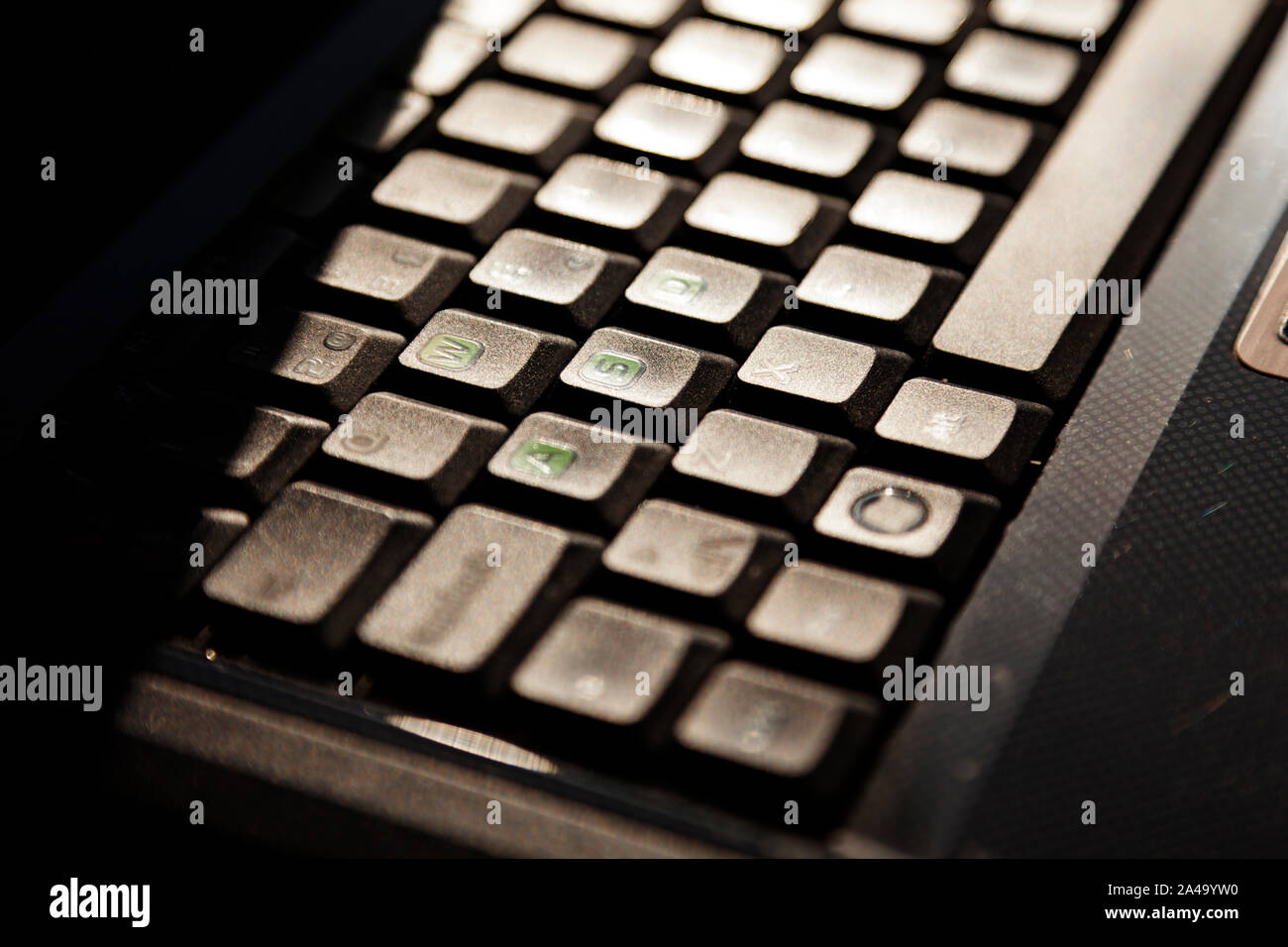keyboard from laptop computer seen from the side in bright sunlight Stock Photo