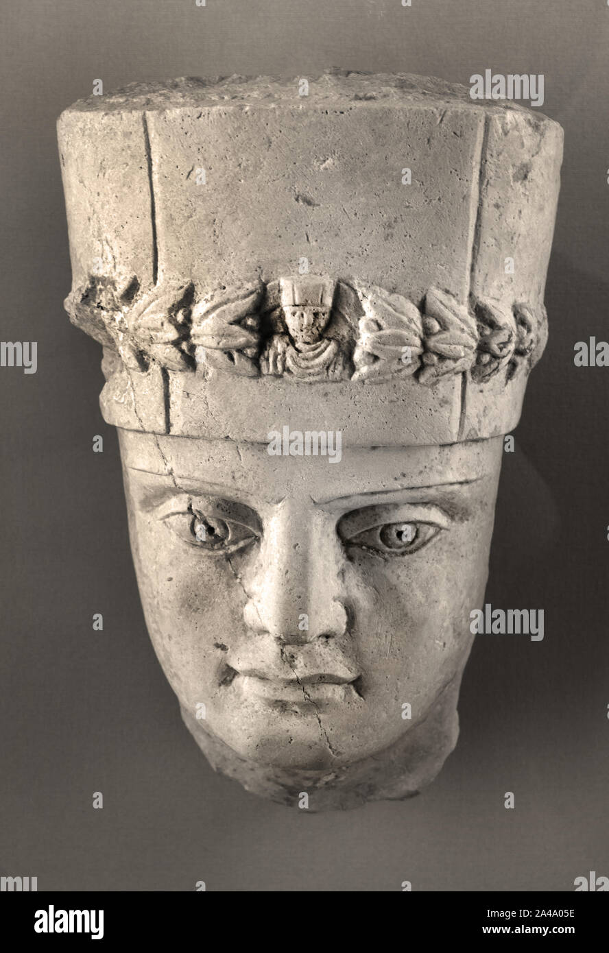 Head of a man wearing the cylindrical hairstyle of priests 3rd century AD (before 272) Palmyra (ancient Tadmor), Syria,Limestone (Element of a carved group adorning the lid of a sarcophagus.) Stock Photo